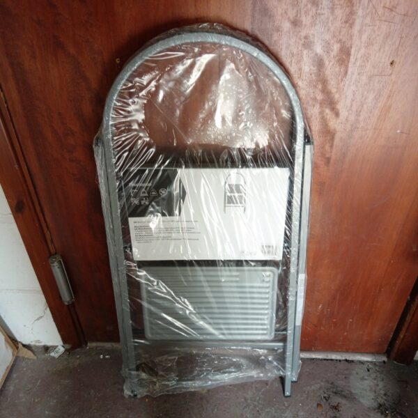 New two-step folding step stool in plastic packaging.