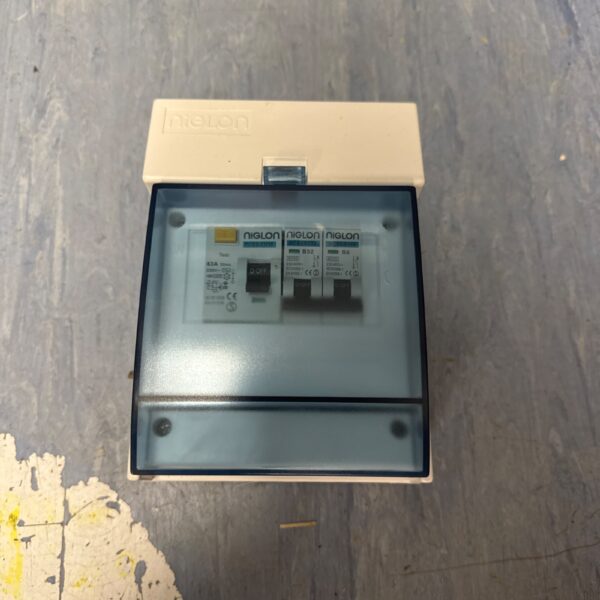 Front view of a small vintage Niglon breaker box.