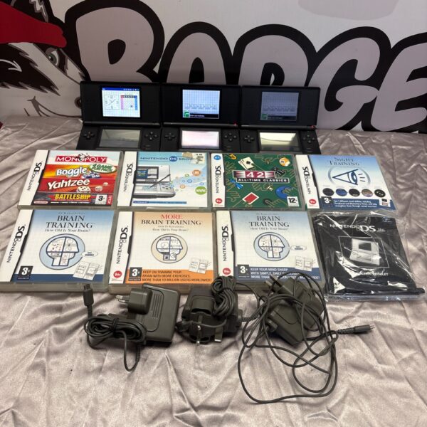 Nintendo DS Lite consoles and games lot for retro gaming collectors.