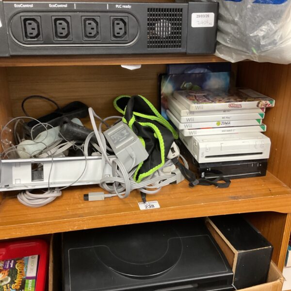 Nintendo Wii console bundle with games and accessories displayed.