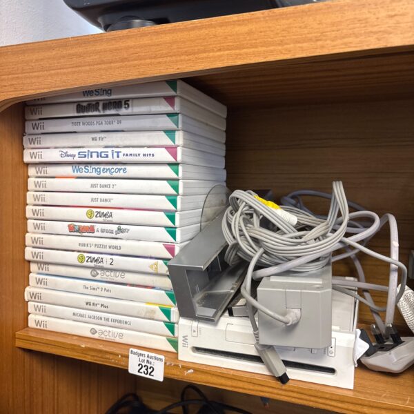 Nintendo Wii console with games and accessories displayed.