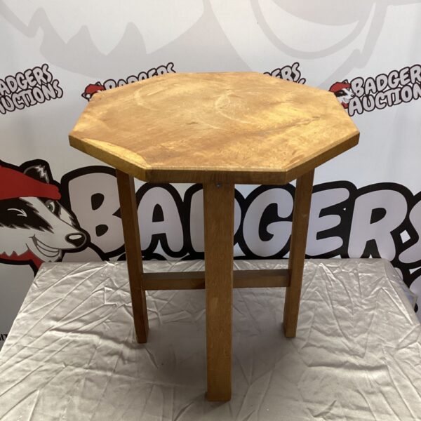 Small octagonal oak lamp table with turned legs.