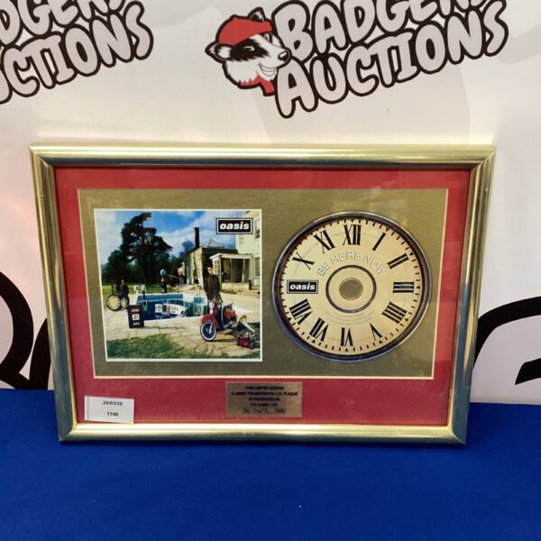 Framed limited edition Oasis "Be Here Now" CD album.