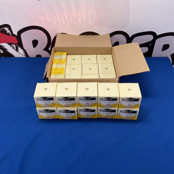 Multiple boxes of unopened Olay Complete Day and Night Cream.