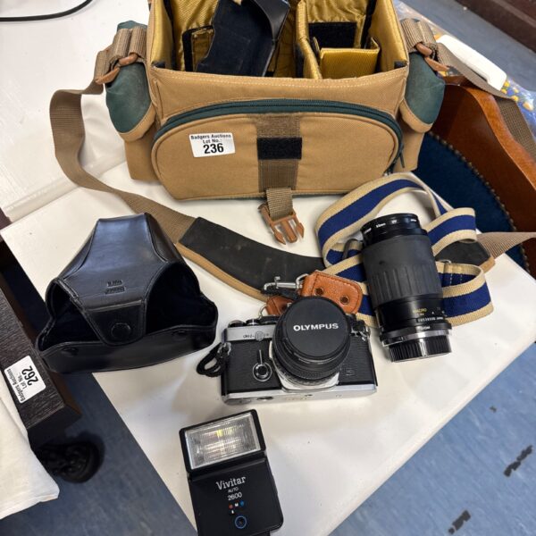 Vintage Olympus OM-2N camera with Vivitar flash and lens.