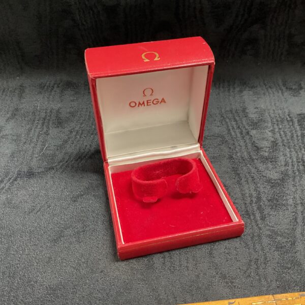 Vintage red Omega watch box, empty presentation case for a timepiece.