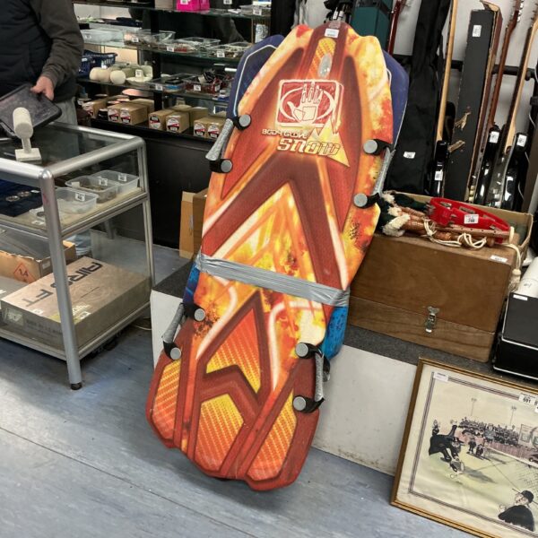 Vibrant orange foam body board for snow sledding.