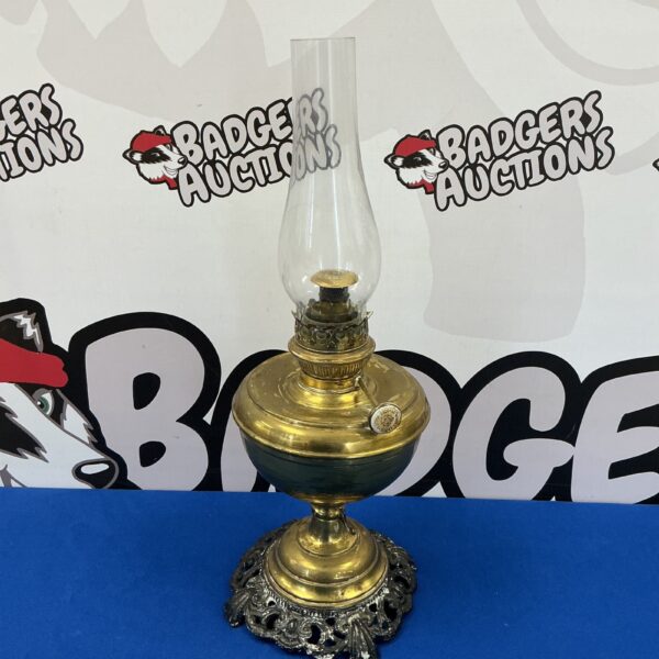 Antique Otto Muller Russian brass oil lamp with glass chimney.