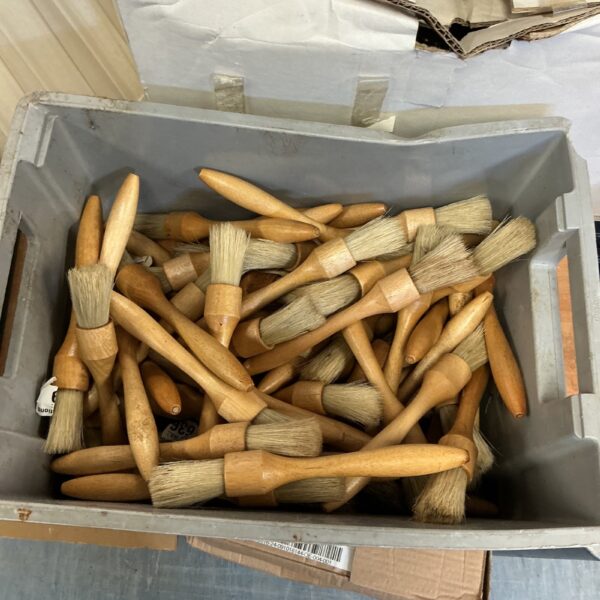 Mixed lot of paint brushes for art and craft projects.