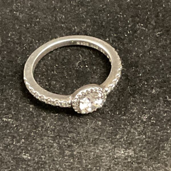 Pandora silver ring size O with cubic zirconia stone.