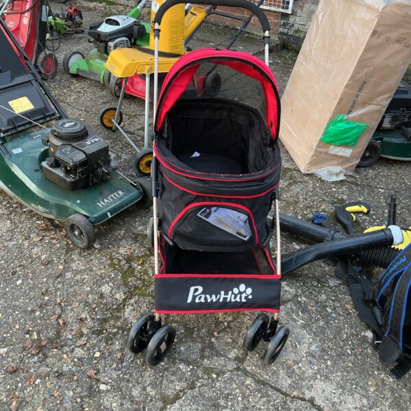 Red and black Paw Hut dog carriage with mesh window.