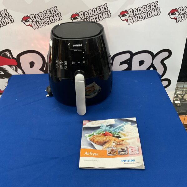 Philips HD9230 Airfryer kitchen appliance with recipe book.
