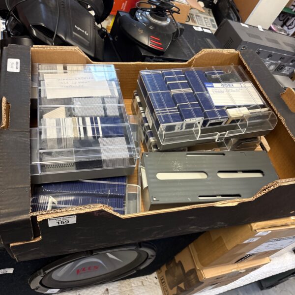 Vintage photographic slides in a storage box, a nostalgic collection.