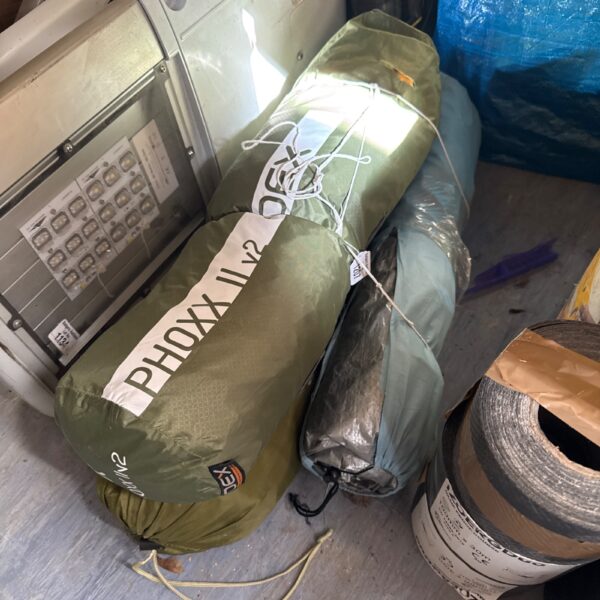 Rolled Phoxx II v2 tent with groundsheet, ready for camping.
