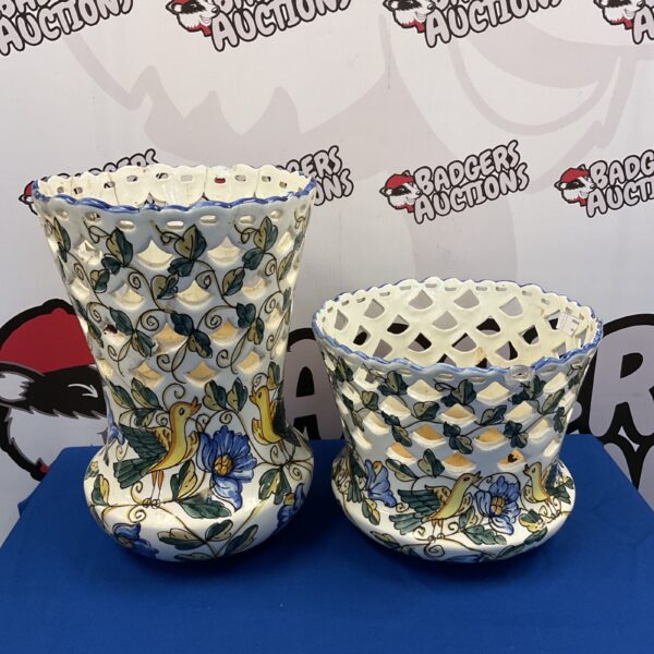 Vintage pierced pottery pots with bird and vine pattern.