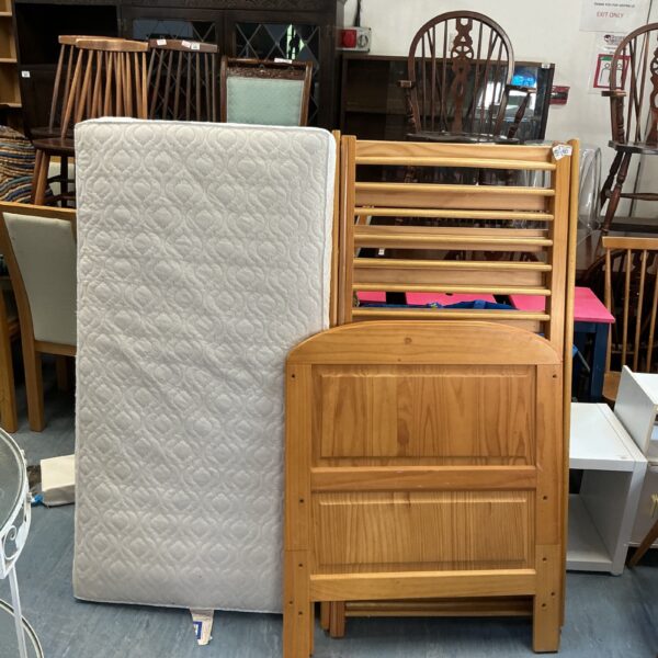 Vintage pine children’s cot with slatted sides.