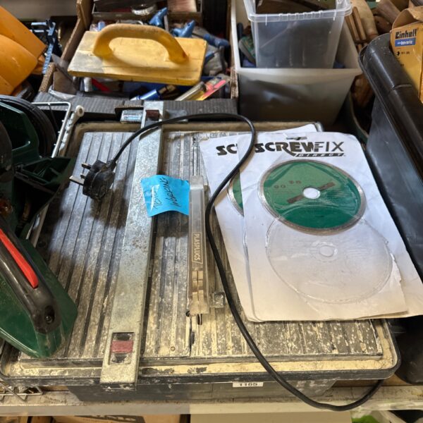 Plasplugs Contractor Plus electric tile cutter with spare blades.