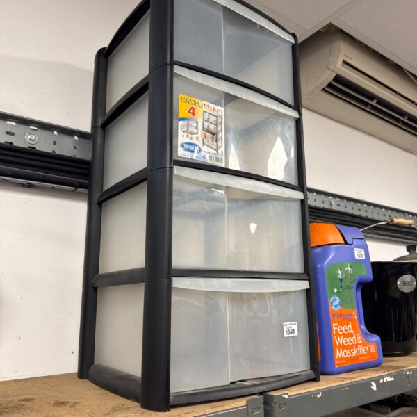 Used plastic storage cabinet with four drawers for home organisation.