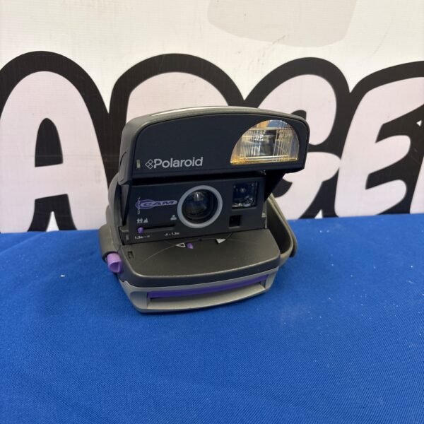 Front view of a vintage Polaroid 600 series instant camera.