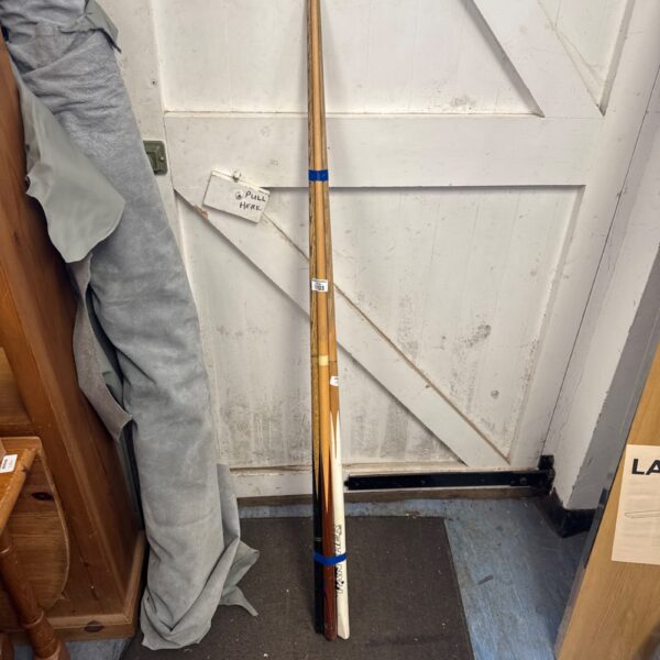 Lot of four pool and snooker cues including a Panther England cue.