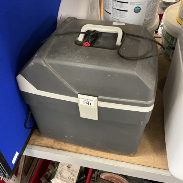 Portable cooler box with 12V car charger connection.