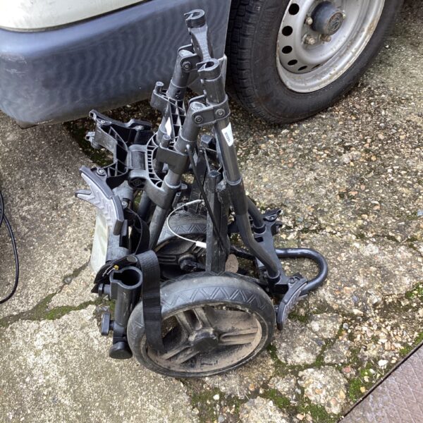 Used Powakaddy Twinlines electric golf trolley in outdoor setting.