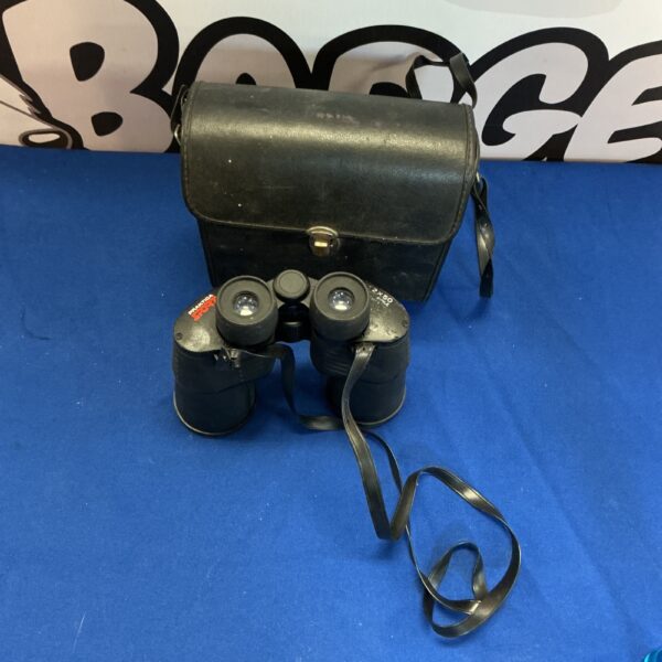 Vintage Pratika 8x30 binoculars with a worn leather case.