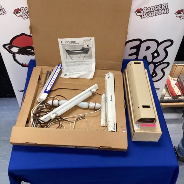 Pro Chrono indoor lighting setup in a cardboard box.