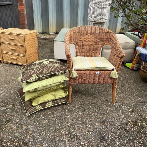 Vintage raffia chair with five cushions for garden or patio.
