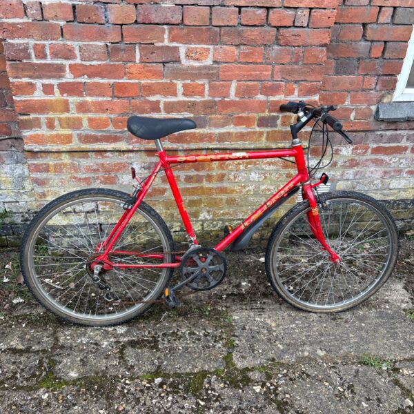 Side view of a vintage Raleigh Scorpion mountain bike.