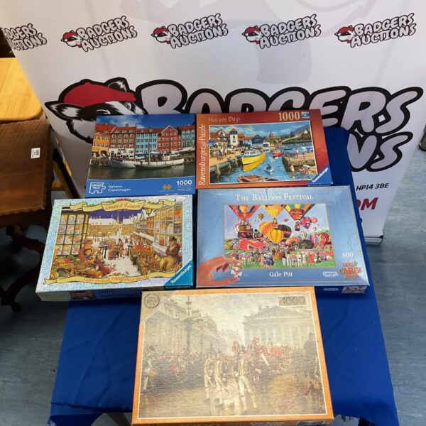 Ravensburger jigsaw puzzle collection featuring a colourful scene.