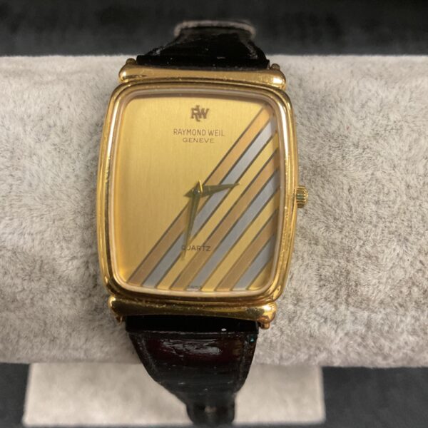 Vintage Raymond Weil quartz watch with gold-toned dial.