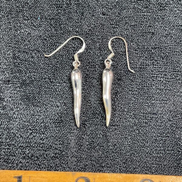Close-up of vibrant red chilli drop earrings in 925 silver.