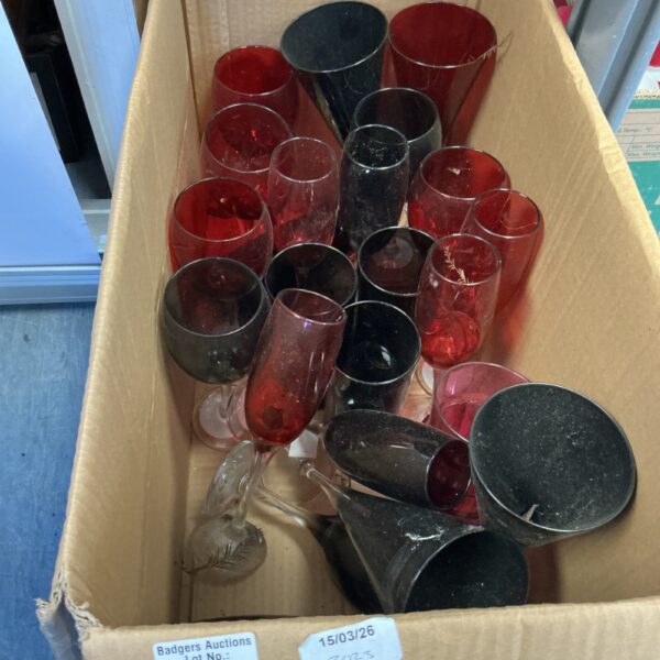 Quantity of vibrant red drinking glasses for parties or everyday use.