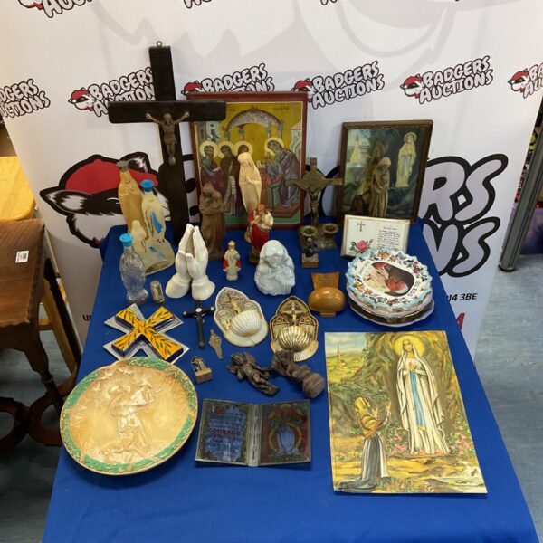 Vintage religious collectibles lot featuring crucifixes and statues.