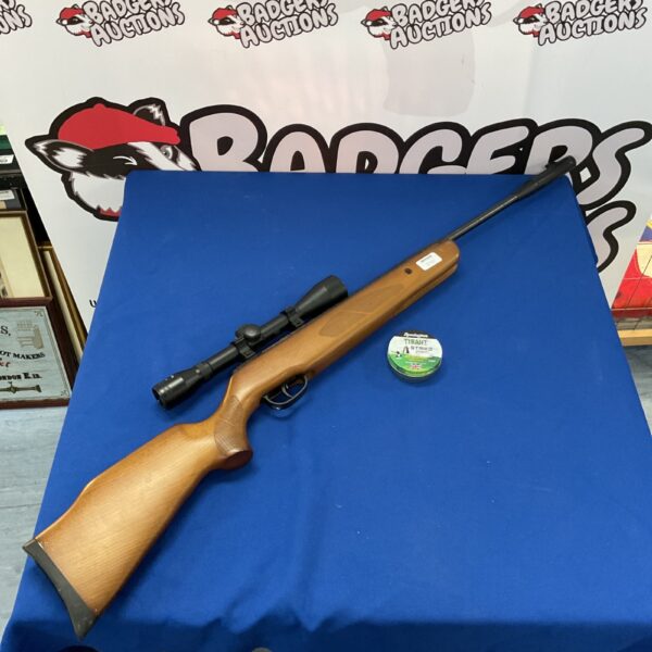 Remington .22 air rifle with Nikko Sterling scope, side view.