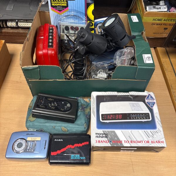 Vintage cassette player and discman in a mixed lot of retro electronics.