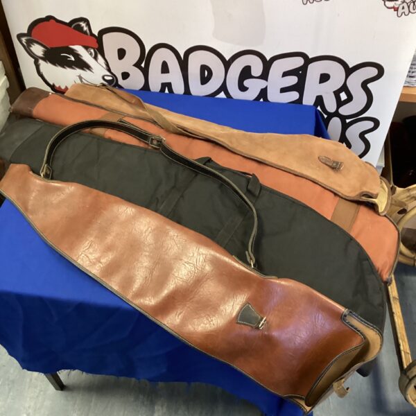 Vintage lot of four rifle slip cases for firearms protection.