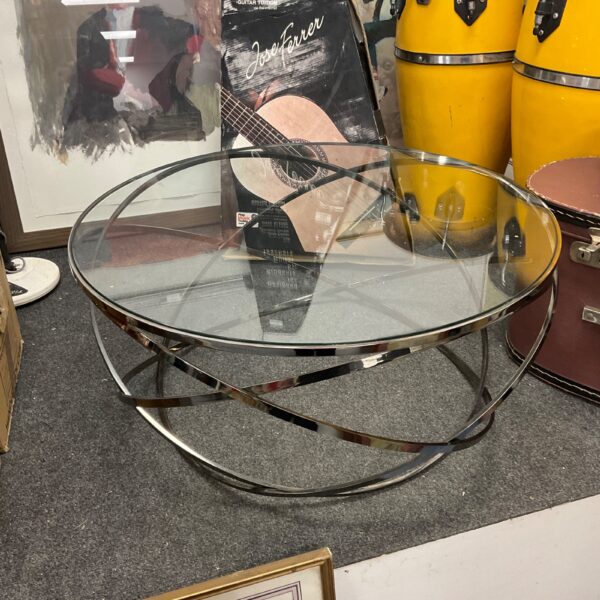 Roche Bobois Evol coffee table with glass top and chrome base.