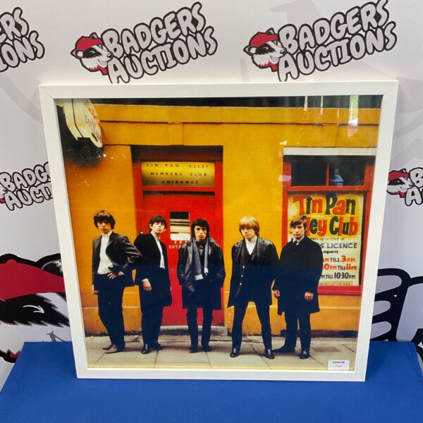 Framed vintage photograph of The Rolling Stones band.