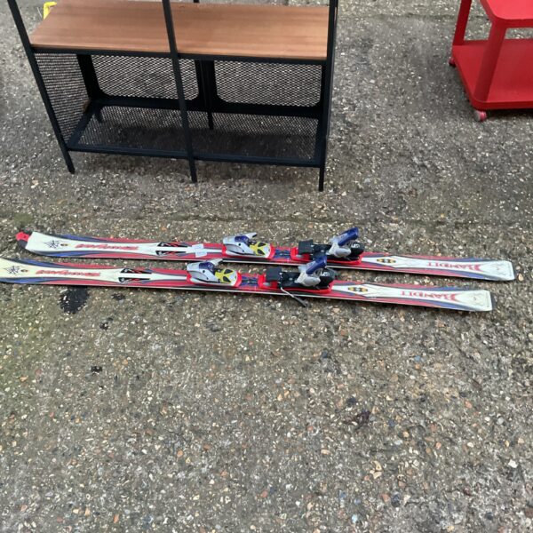 Pair of used Rossignol carving skis for winter sports.