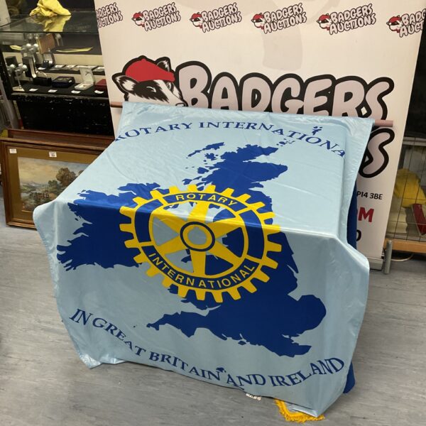 Vintage Rotary Club International banner with iconic wheel logo.