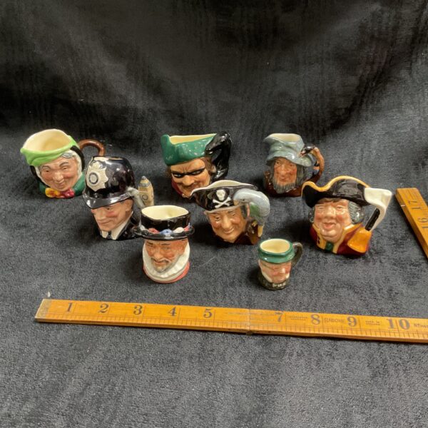 Royal Doulton character figures collection, including Long John Silver.