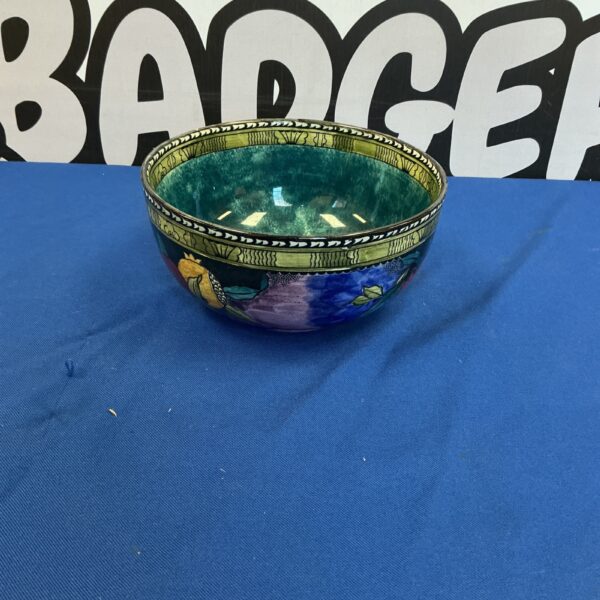 Antique Ruben Ware bowl with vibrant pomegranate design.