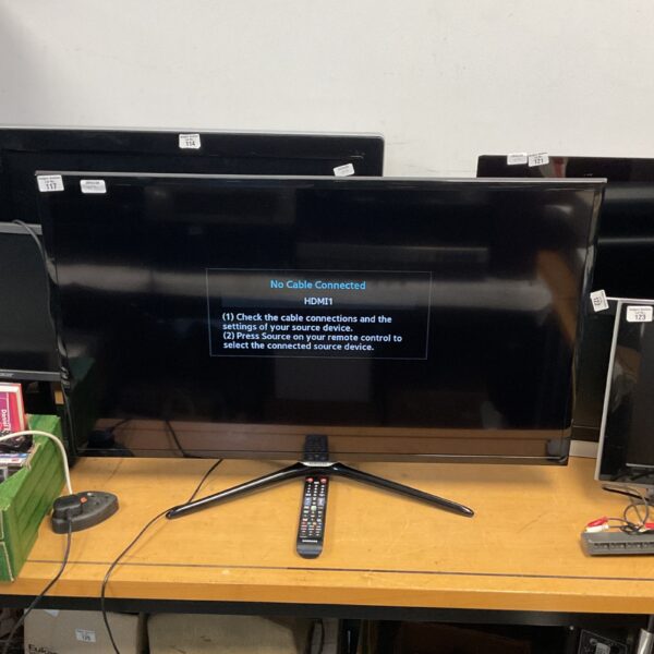 Samsung 40 inch television with remote control, model UE40F5500AKXXU.