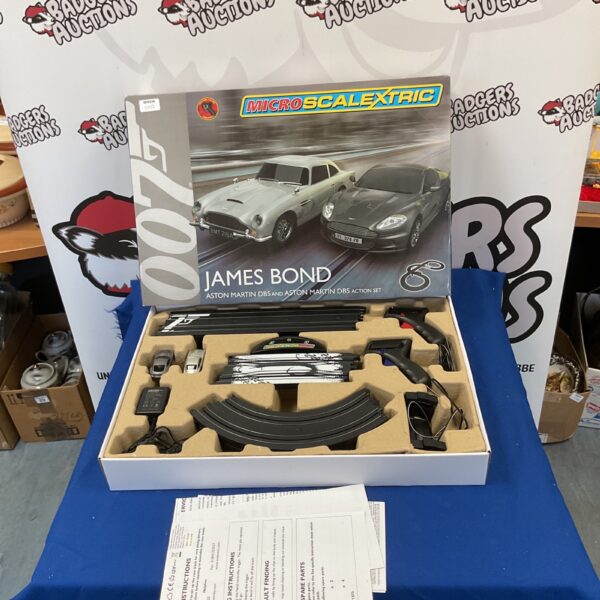 Micro Scalextric James Bond Aston Martin set with track pieces.