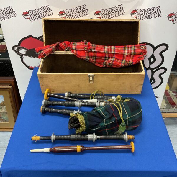 Vintage Scottish bagpipes set with tartan bag and spare chanter.