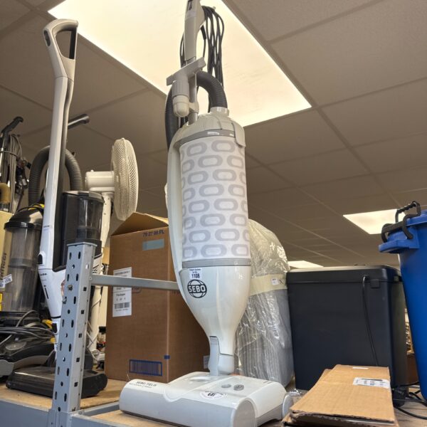 Sebo Felix vacuum cleaner in a home appliance setting.