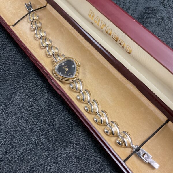 Vintage Sekonda ladies watch with heart-shaped dial and bi-colour bracelet.