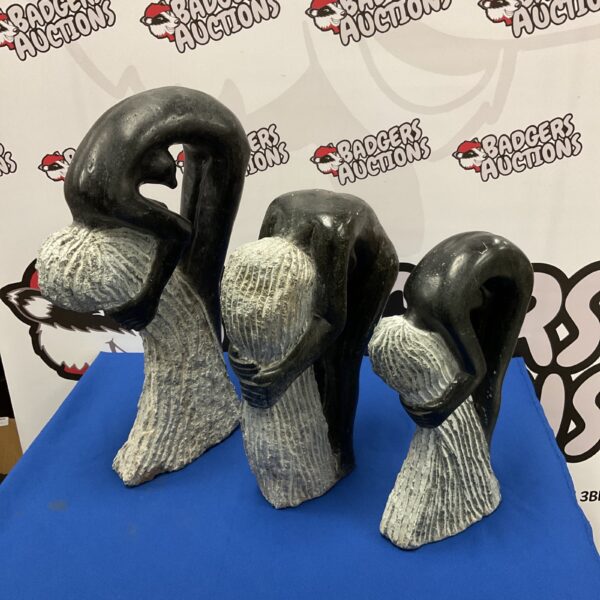 Set of three graduated shana stone nude sculptures.